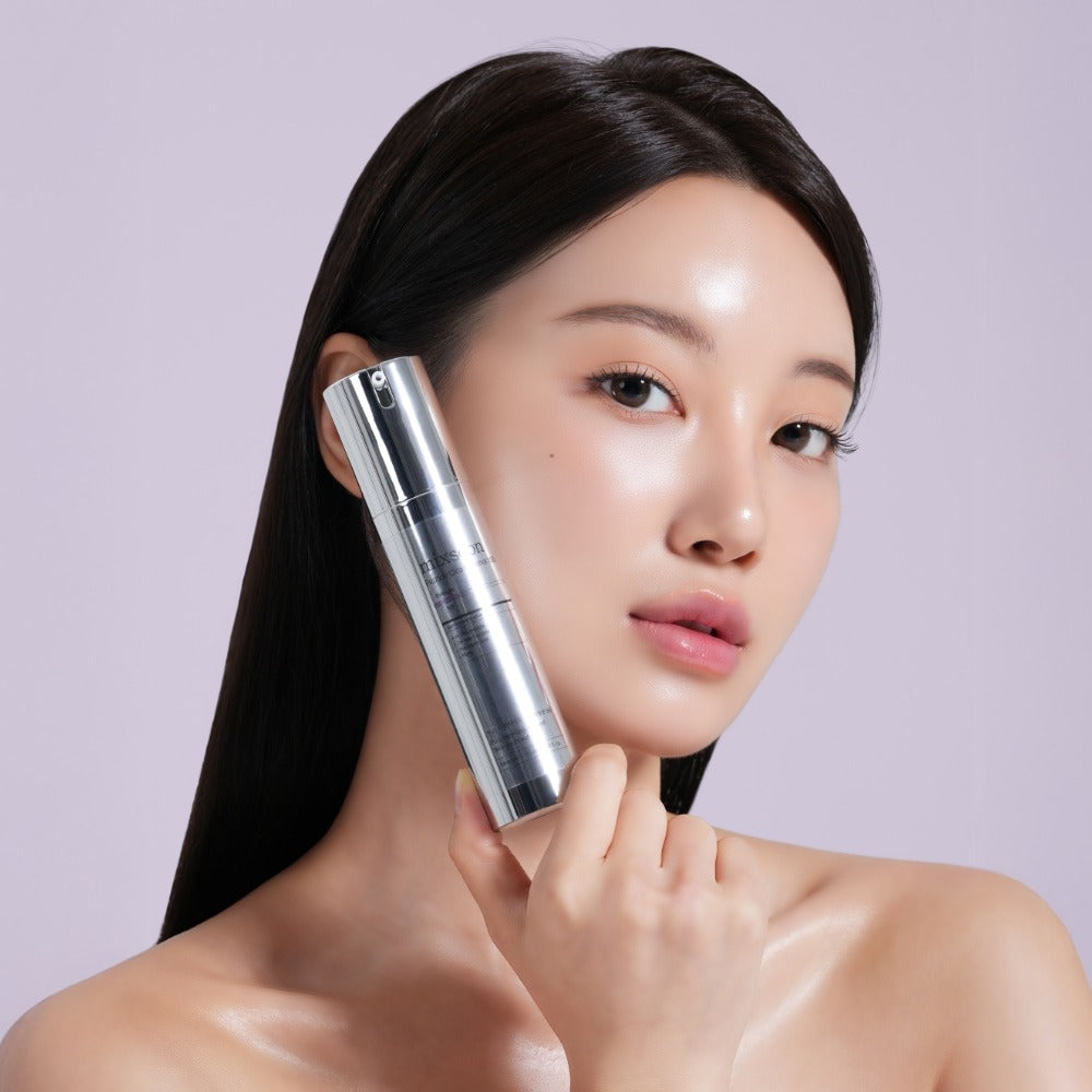 Woman holding MIXSOON Peptide Cica Hyal Shot 150 50ml skincare product against pastel background