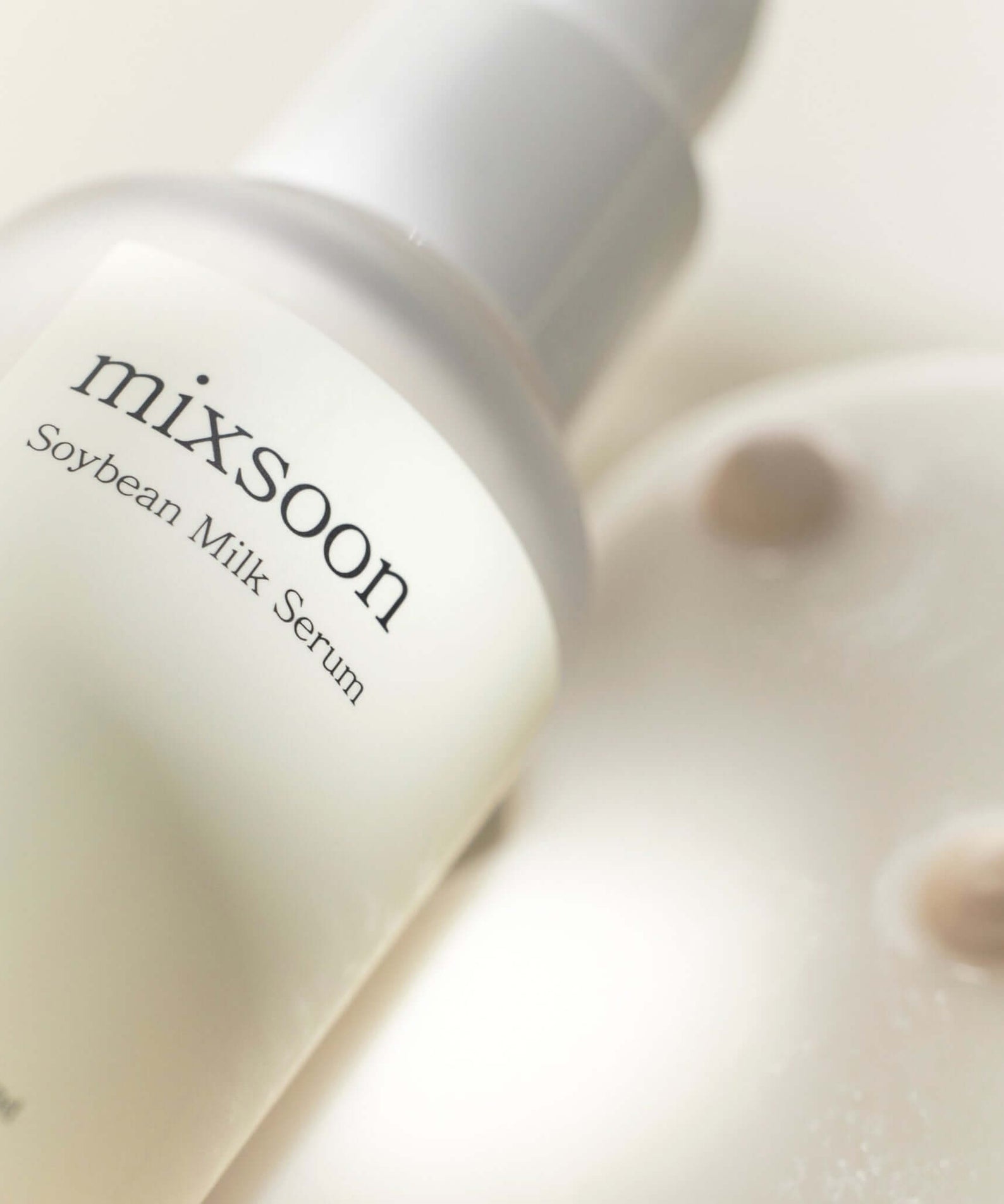 MIXSOON Soybean Milk Serum 50ml bottle close-up on creamy texture surface