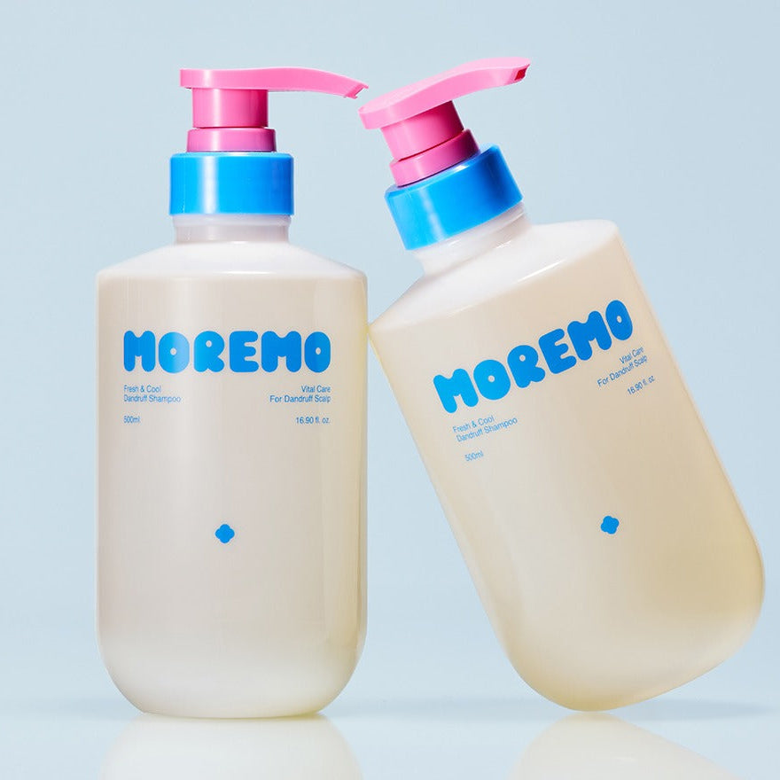 Photo of MOREMO Fresh & Cool Dandruff Shampoo 500ml bottles with pink and blue pump dispensers on a blue background.