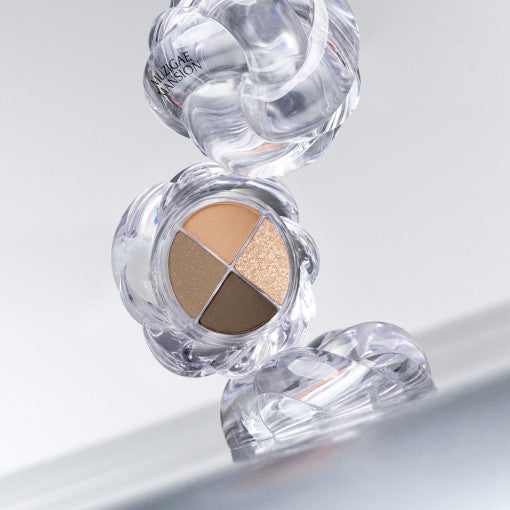 MUZIGAE MANSION Twist Pot Eye Palette featuring neutral and shimmer shades in a unique clear case.