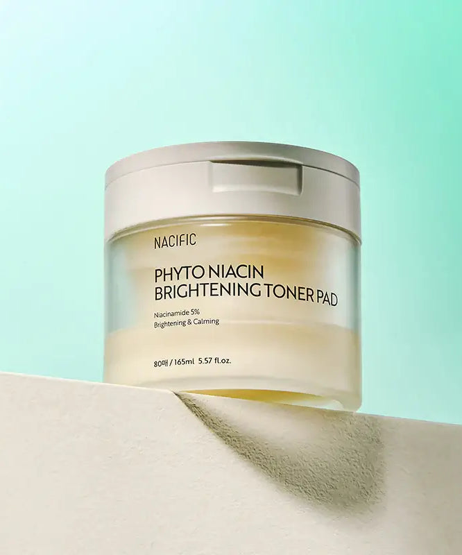 NACIFIC Phyto Niacin Brightening Toner Pads 80 Sheets/165ML on a shelf with green background.