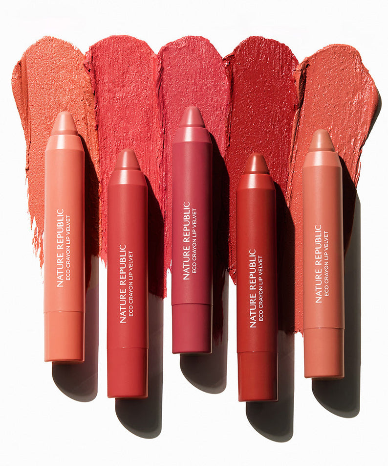 NATURE REPUBLIC By Flower Eco Crayon Lip Velvet in assorted colors displayed on a white background, showcasing vibrant lip color options.