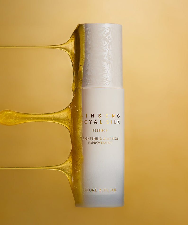 NATURE REPUBLIC Ginseng Royal Silk Essence 40ml product bottle with shimmering background