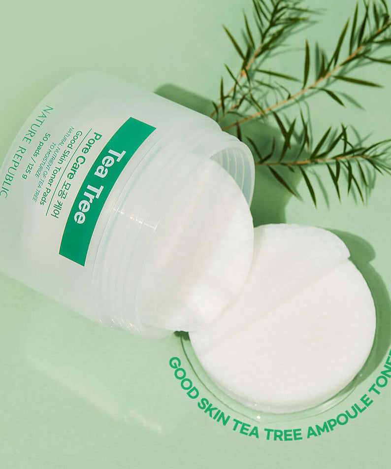 NATURE REPUBLIC Good SKin Tea Tree Ampoule Toner Pads 125g on green background with tea tree leaves
