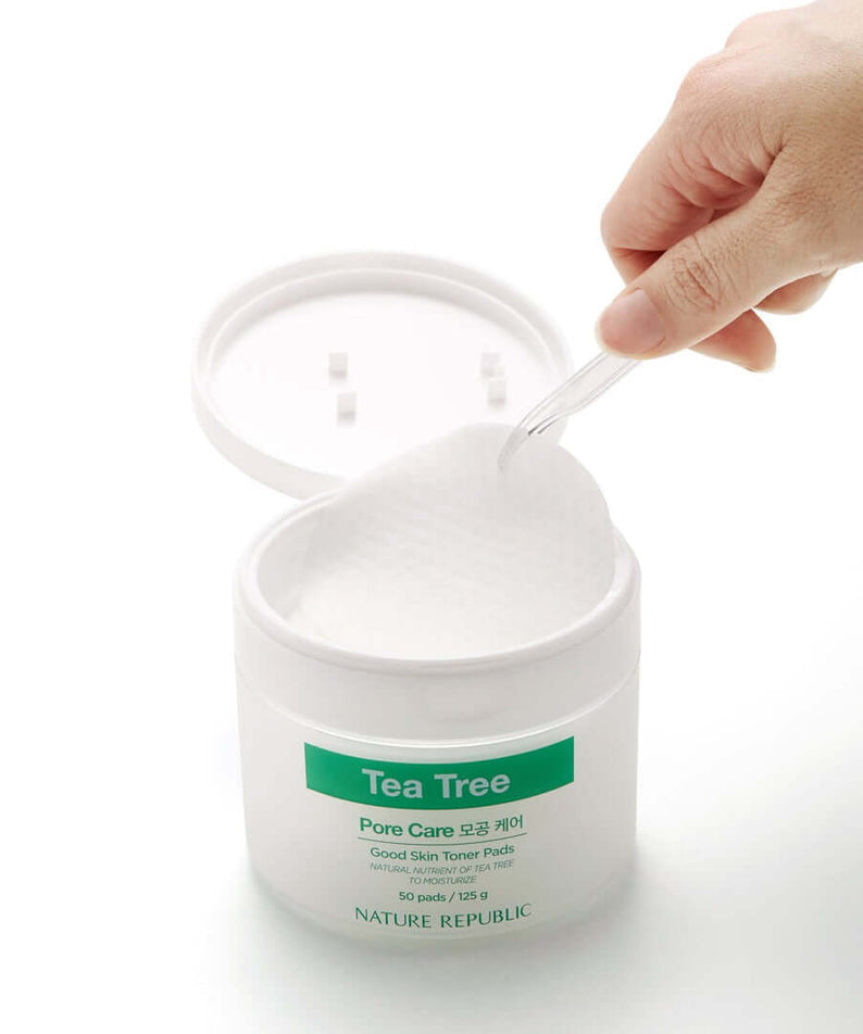 NATURE REPUBLIC Good SKin Tea Tree Ampoule Toner Pads 125g container with a hand picking a pad, skincare product for pore care