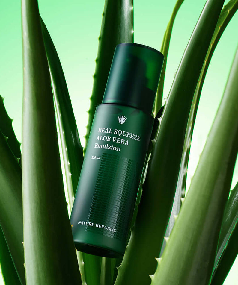 NATURE REPUBLIC Real Squeeze Aloe Vera Emulsion 130ml with green aloe vera leaves in the background.