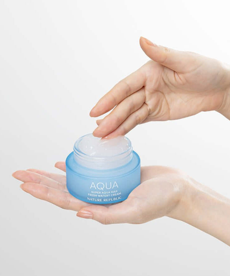 NATURE REPUBLIC Super Aqua Max Fresh Watery Cream 80ml held in hands, showcasing texture and packaging.