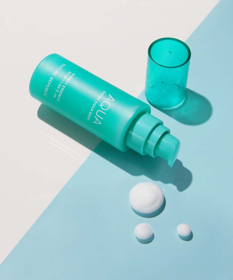 NATURE REPUBLIC Super Aqua Max Moisture Essece 50ml product with cap and droplets on blue background