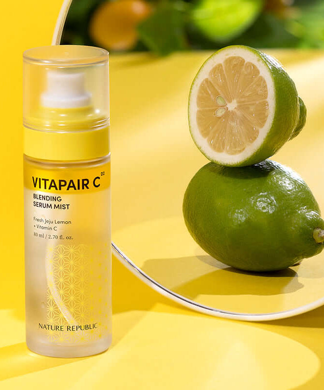 NATURE REPUBLIC Vitapair C Blending Serum Mist 80ml with citrus backdrop highlighting vitamin C ingredients.