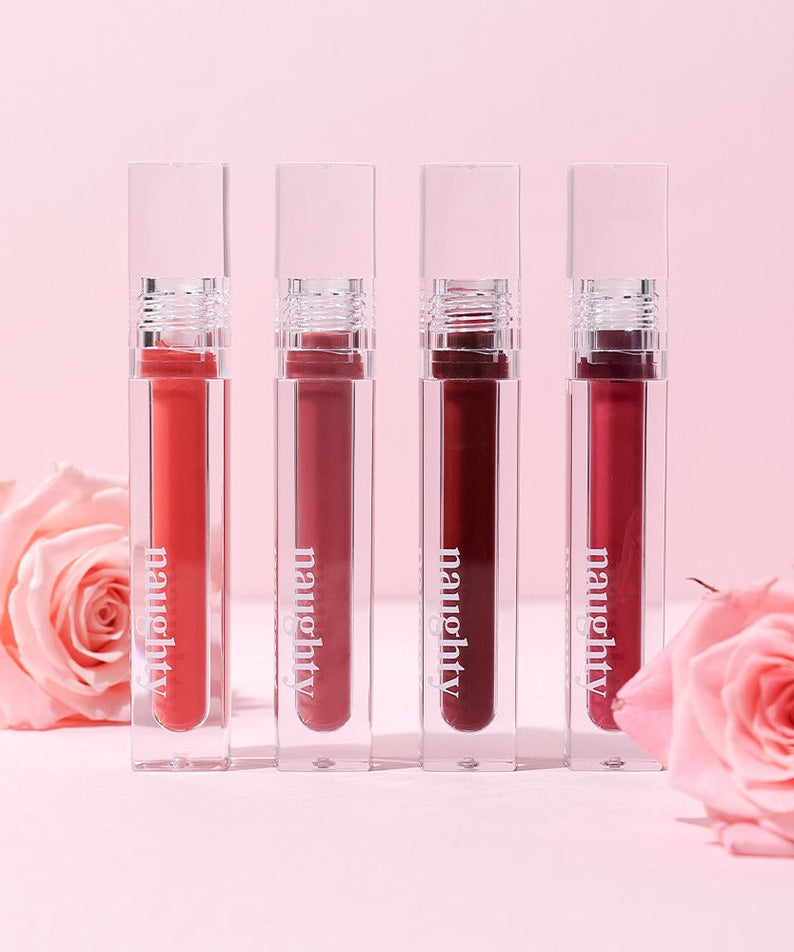 NAUGHTY PERCENT Matte Bloom Tint lipsticks with pink roses on a pastel pink background