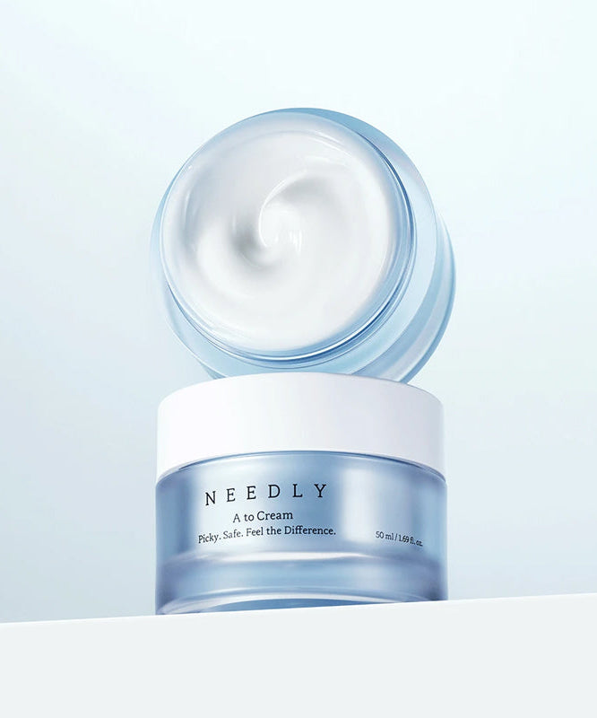 NEEDLY A to Cream 50ml jar showing creamy texture. Skincare product for effective moisturizing.