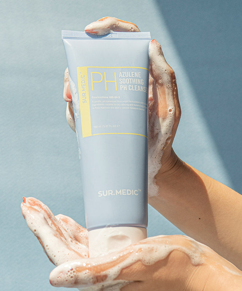 Hands holding NEOGEN Azulene Soothing Midly Acidic Cleanser 150ml with foam lather.