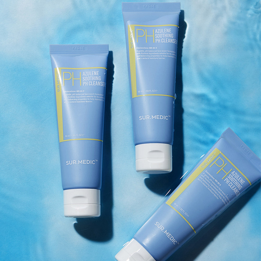 Three blue tubes of NEOGEN Azulene Soothing Midly Acidic Cleanser 150ml placed on a blue surface.