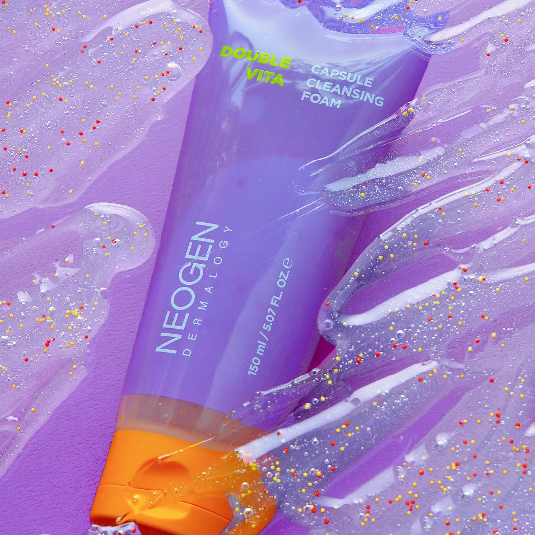NEOGEN Dounble Viita Capsual Cleansing Foam 150ml purple tube on textured background