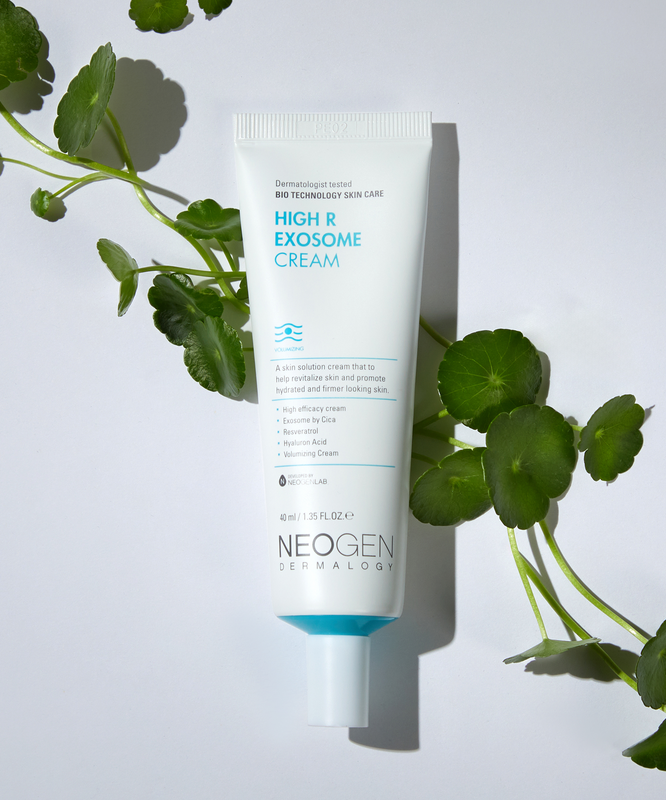 Image of NEOGEN Hyal Exosome Cream 40ml tube with green leaves on white background for skincare.