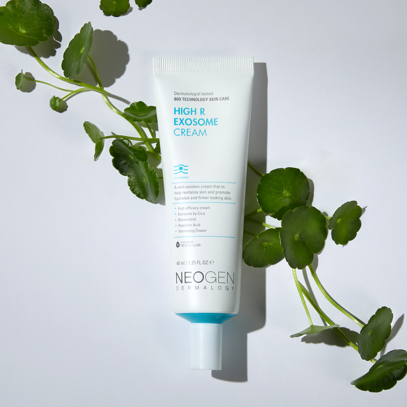 Image of NEOGEN Hyal Exosome Cream 40ml tube with green leaves on white background for skincare.
