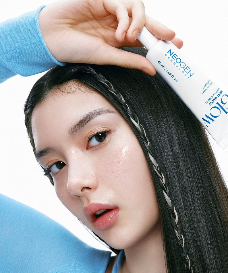 NEOGEN Next Glow 3-piece set (prep serum + moisture cream + pore refining toner) held by model for skincare demonstration.