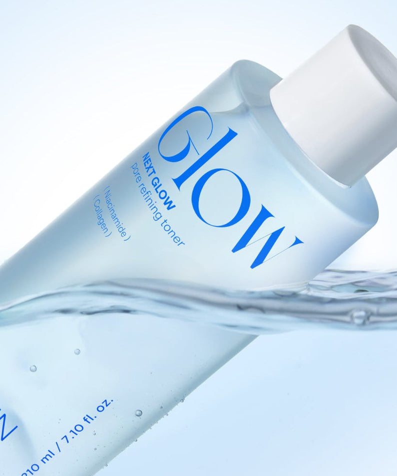 Image of NEOGEN Next Glow Pore Refining Toner 210ml bottle with blue liquid against a light background.