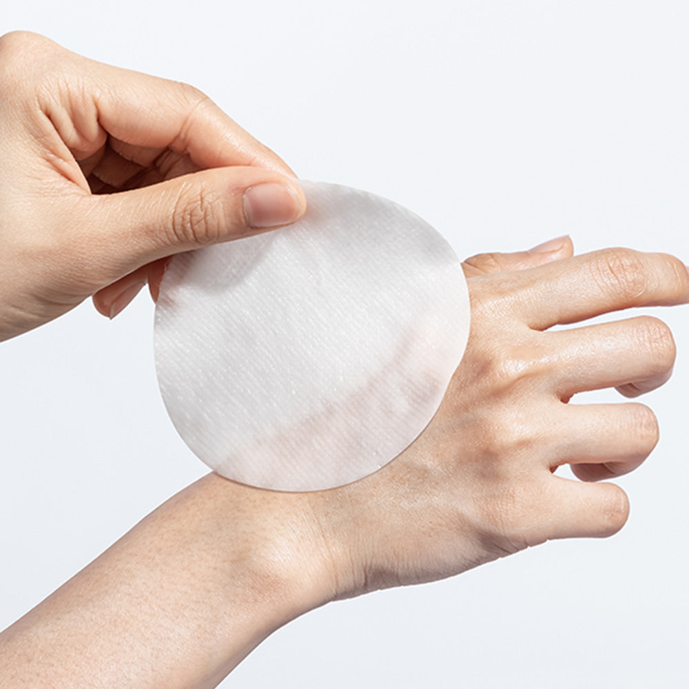 Using NEOGEN Niacinamide Glow Up Daily Mask Pads 40 Sheets on skin for a glowing complexion.