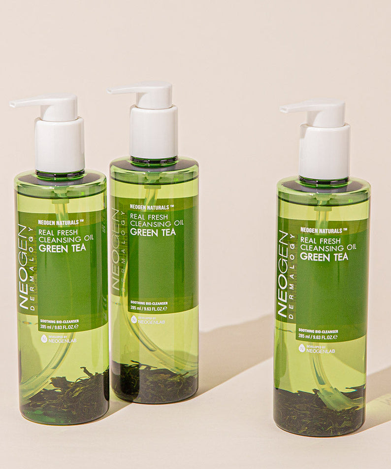Three bottles of NEOGEN Real Fresh Cleansing Oil Green Tea 285ml displayed against a neutral background.