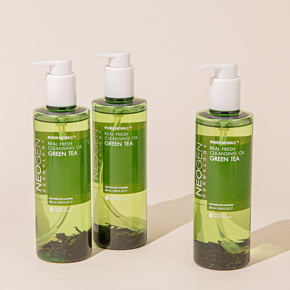 Three bottles of NEOGEN Real Fresh Cleansing Oil Green Tea 285ml displayed against a neutral background.