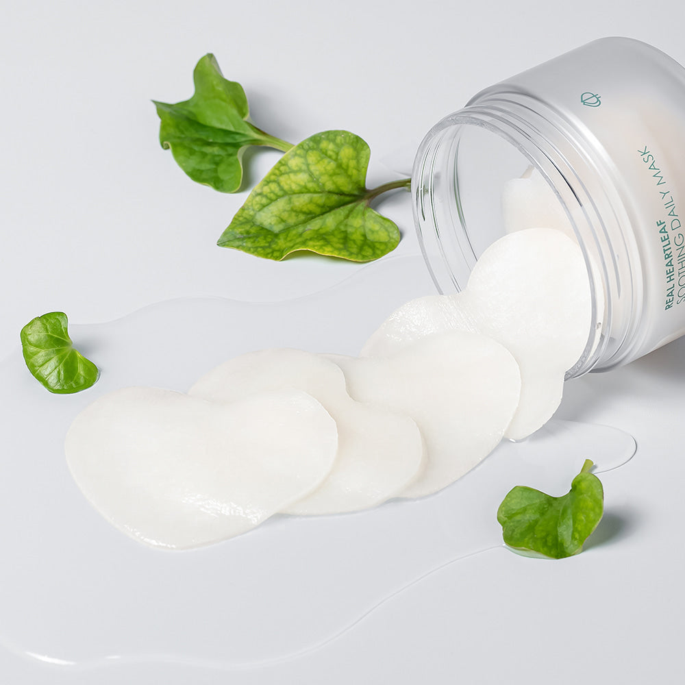 NEOGEN Real Heartleaf Soothing Daily Mask 40 Sheets displayed with product packaging and heartleaf greenery in the background.