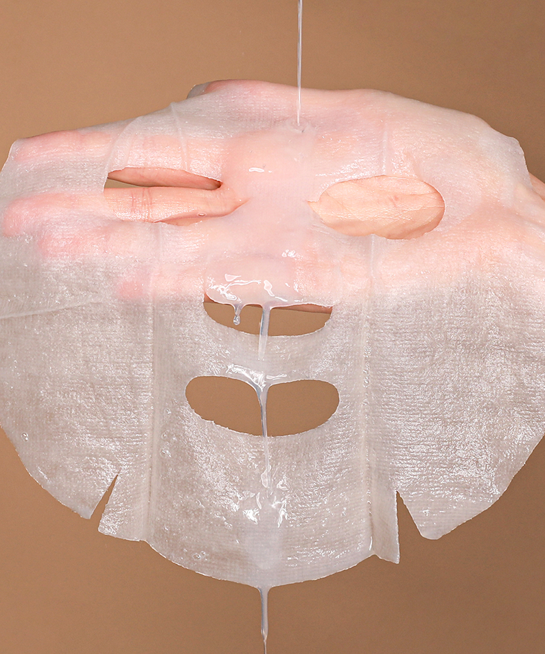 NEOGEN Real Heartleaf Soothing Mask 5 Packs being shown by hand to display its texture and quality.