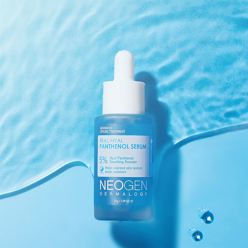 NEOGEN Real Hya Panthenol Serum 30ml bottle on blue background with water drops