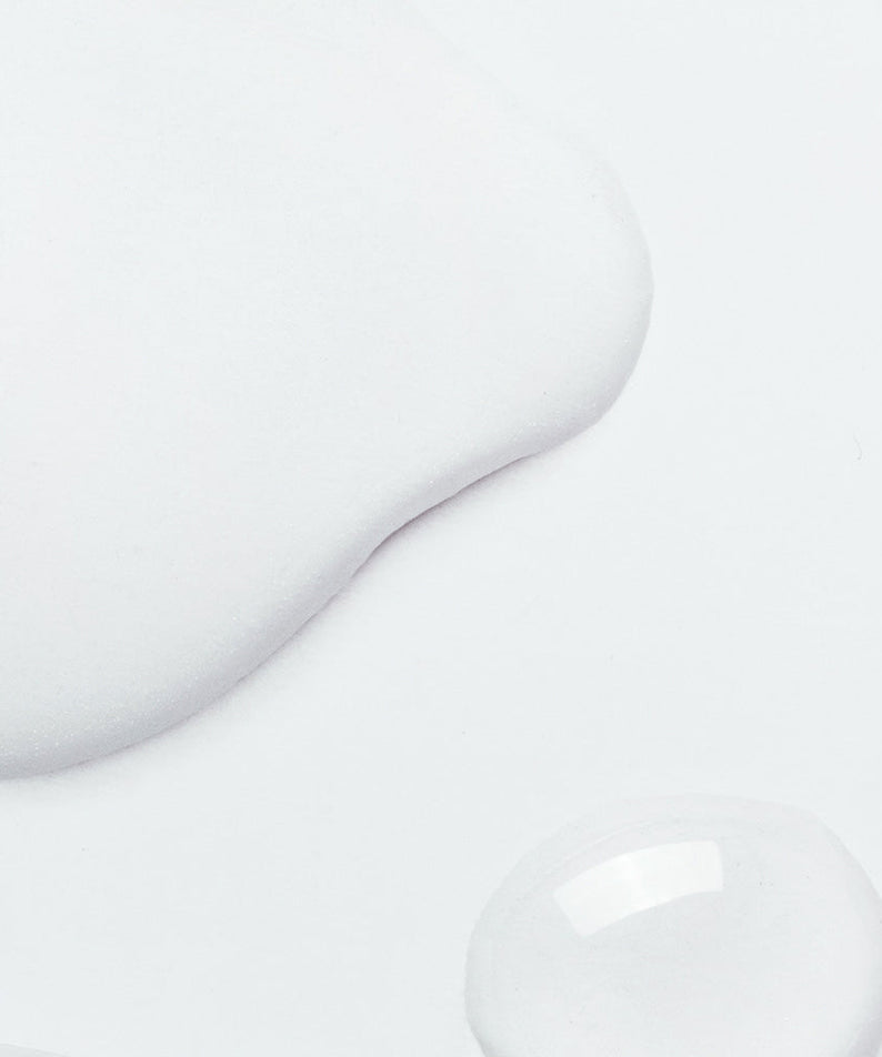 Texture of NEOGEN V Biome Infusion Serum 30ml on a white background, showcasing its smooth and hydrating qualities.
