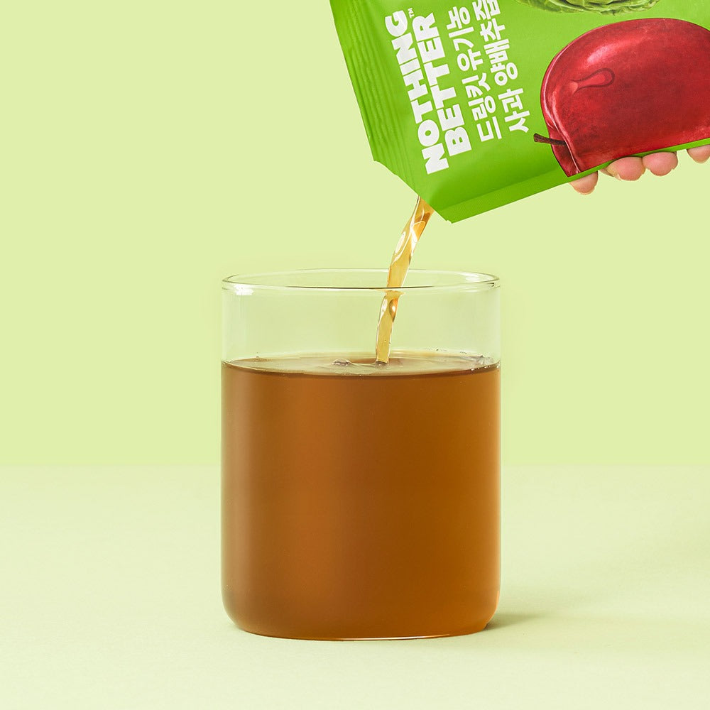 NOTHING BETTER Drinkit Organic Applr Cabbage Juice 100ml 24 Packets being poured into a glass
