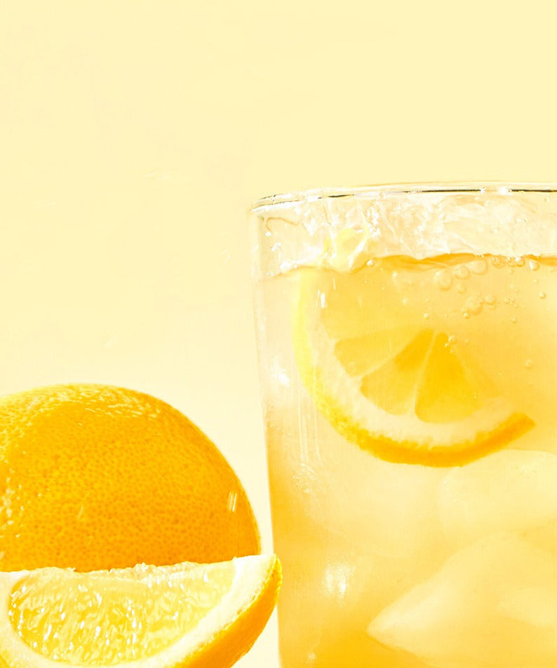 NOTHING BETTER Inner Juice 100% Lemon Cleanse Juice 100ml (X24) with fresh lemon slices and ice in a refreshing beverage