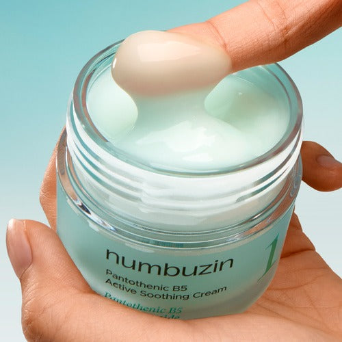Close-up of NUMBUZIN No.1 Pantothenic Acid Active Soothing Cream 80ml being applied on finger from jar