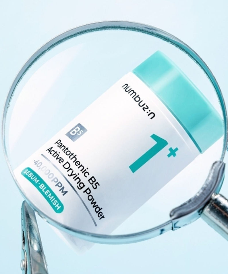 NUMBUZIN No.1 Pantothenic Acid Active Up Dressing Powder 7g under magnifying glass, highlighting product details and packaging.