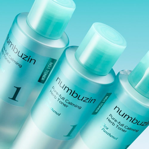 Three bottles of NUMBUZIN No.1 True Clear Toner 300ml with light blue labels, arranged on a blue background.