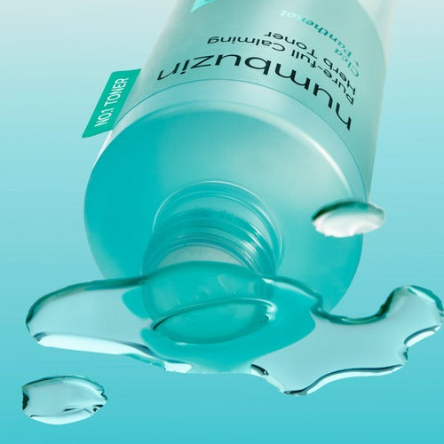 NUMBUZIN No.1 True Clear Toner 300ml bottle with liquid pouring on a blue background.