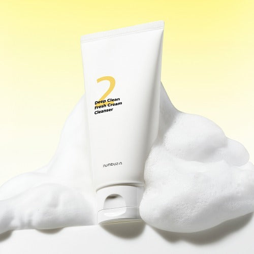 NUMBUZIN No.2 Deep Clean Cream Cleansing Foam 120ml displayed on foamy background with yellow gradient.