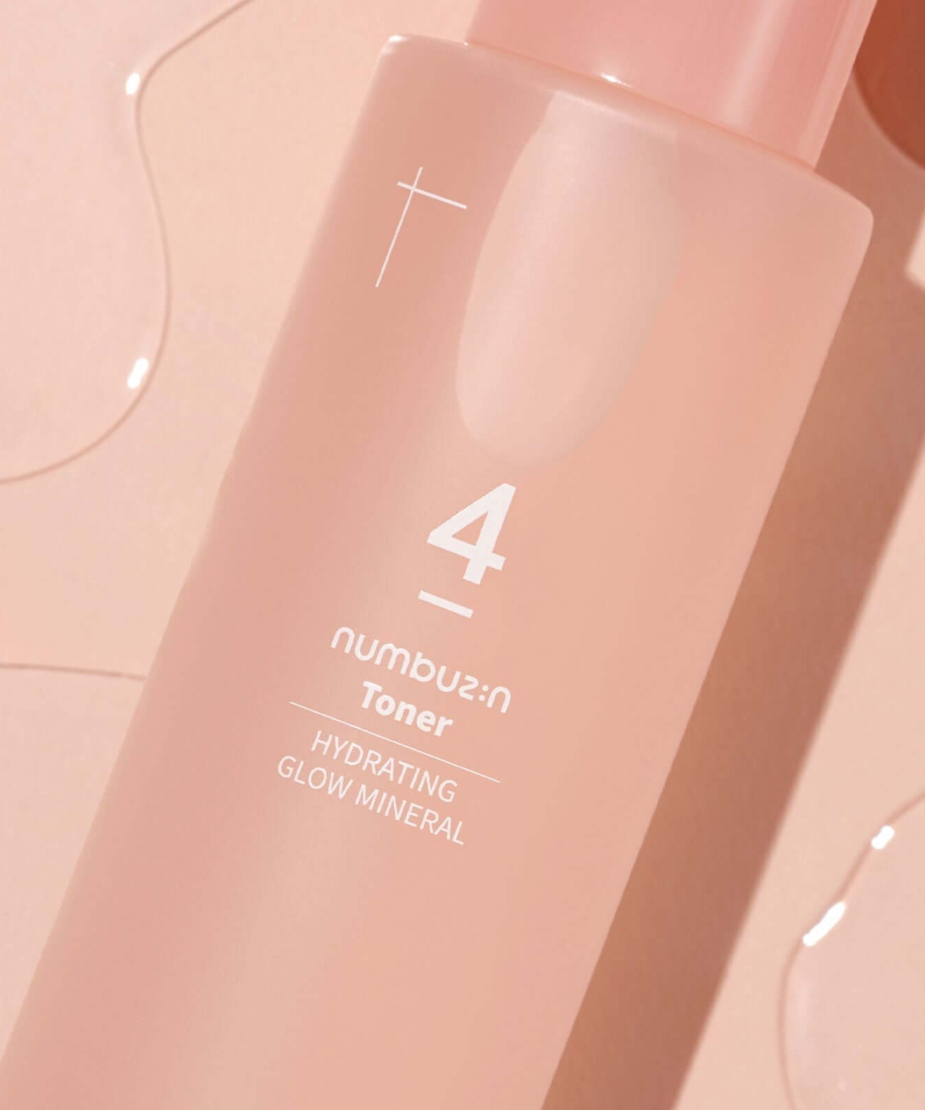 NUMBUZIN No.4 Hydration Glow Mineral Toner bottle on pink background