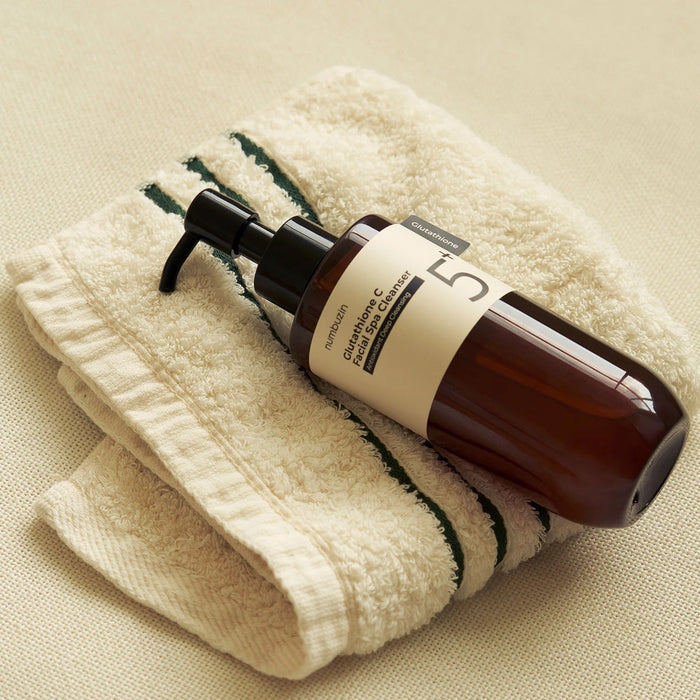 NUMBUZIN No.5 Glutathione C Aroma Massage Deep Cleanser 200ml bottle on a soft towel