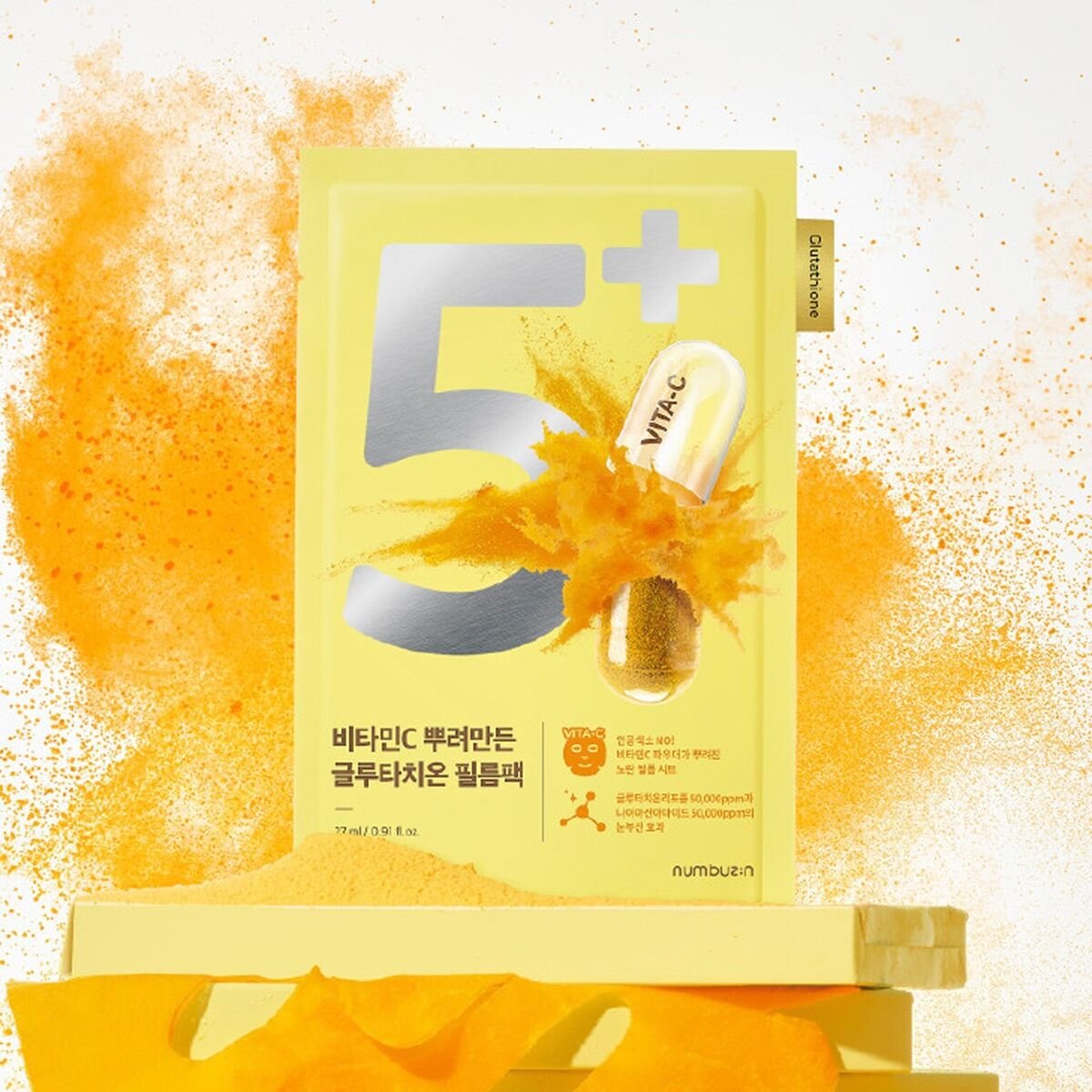 NUMBUZIN No.5 Vitamin Spotlight Sheets Mask with vibrant packaging and vitamin powder burst in the background.