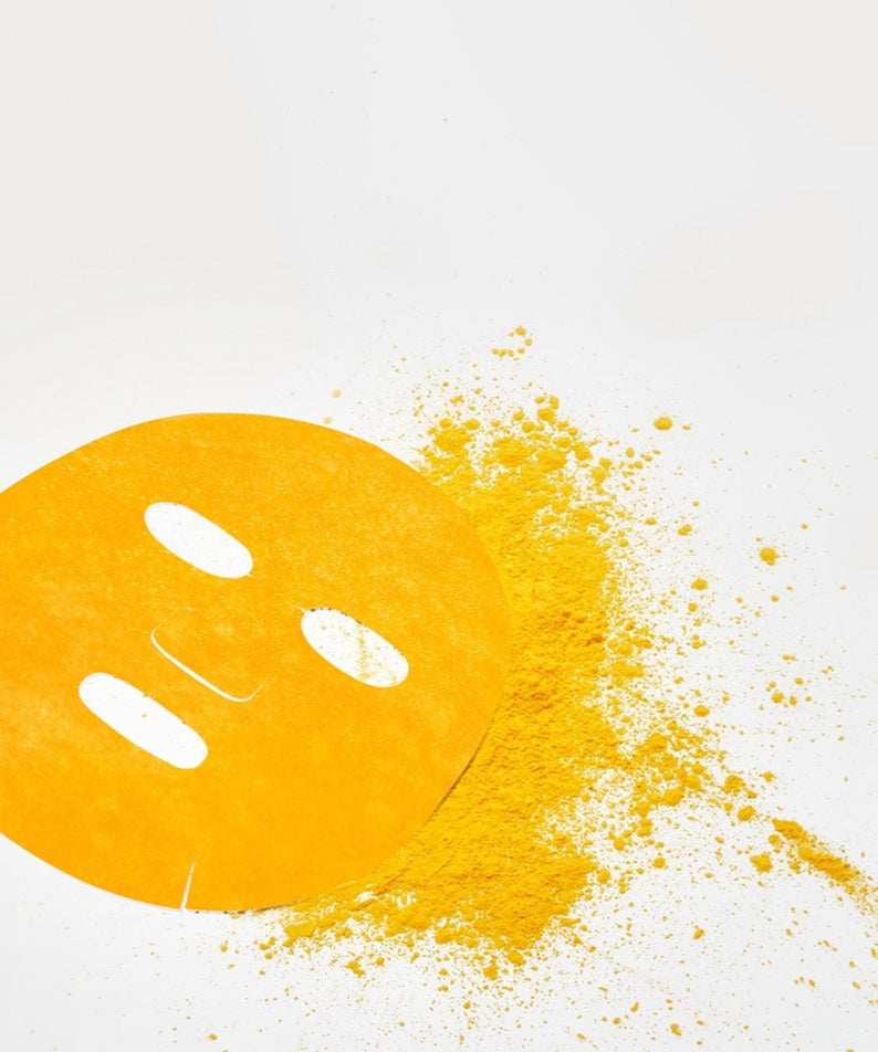 NUMBUZIN No.5 Vitamin Spotlight Sheets Mask with vibrant yellow color and powder on a white background.