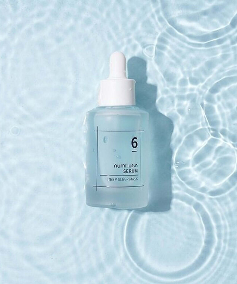NUMBUZIN No.6 Deep Sleep Mask Serum bottle on rippled water surface, showcasing skincare packaging.