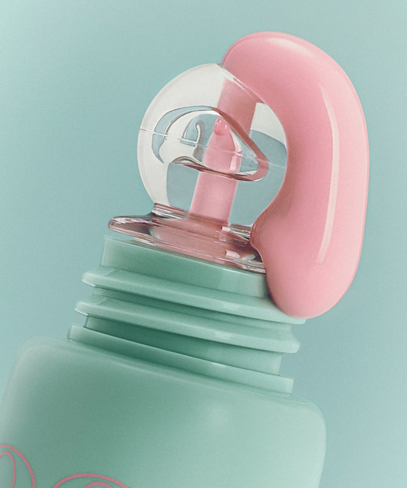 Close-up image of the NUSE Mousse Care Cheek Handy product top with pink mousse texture on mint green packaging.