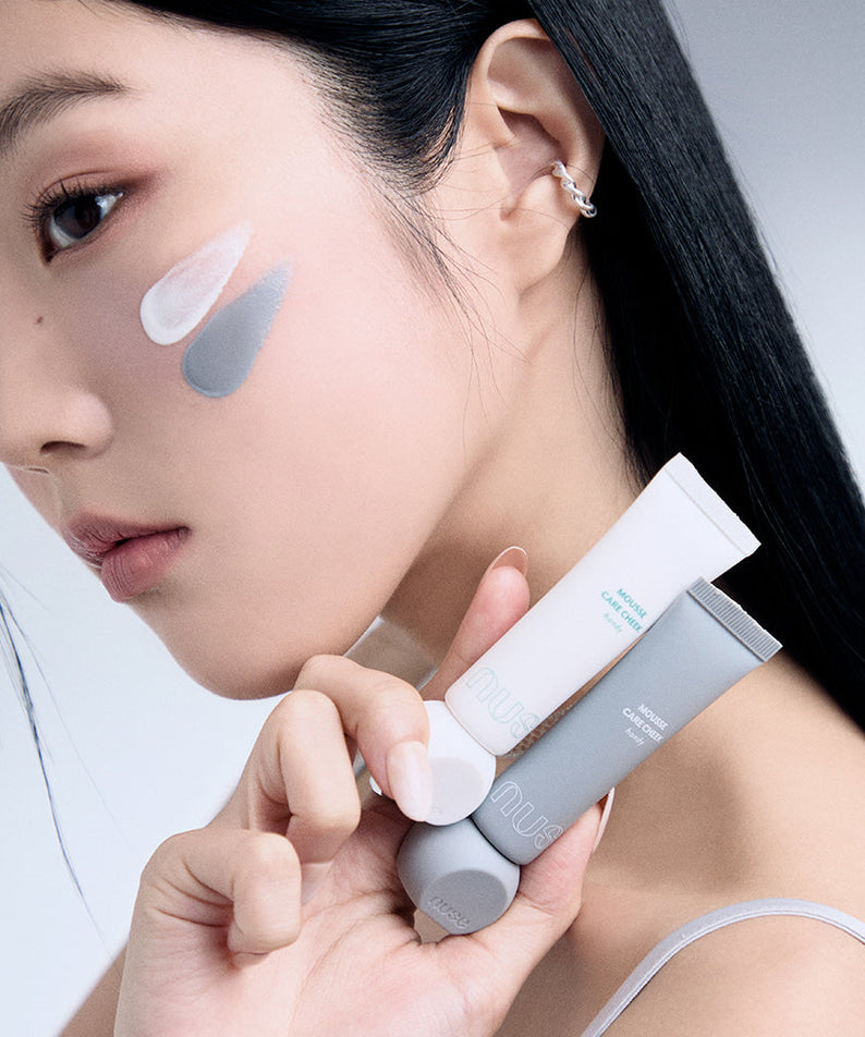 Model applying NUSE Mousse Care Cheek Handy cream on face