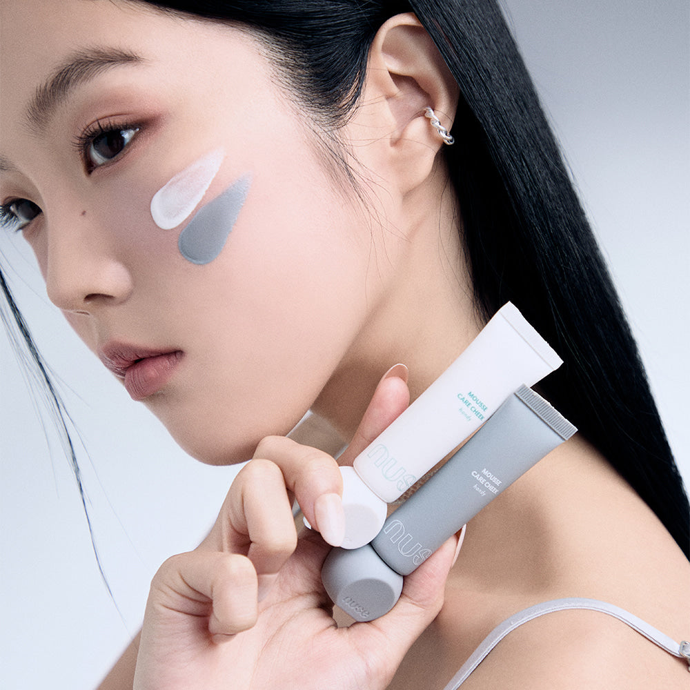 Model applying NUSE Mousse Care Cheek Handy cream on face