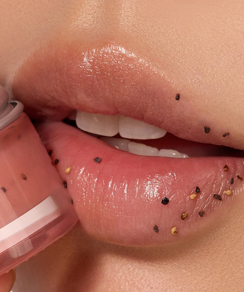 Close-up of lips with NUSE Seed Care Lip Scrub applied, showing exfoliating seeds for smoothness and hydration.