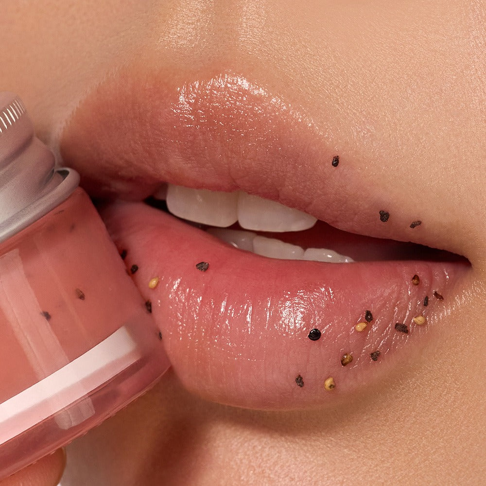 Close-up of lips with NUSE Seed Care Lip Scrub applied, showing exfoliating seeds for smoothness and hydration.