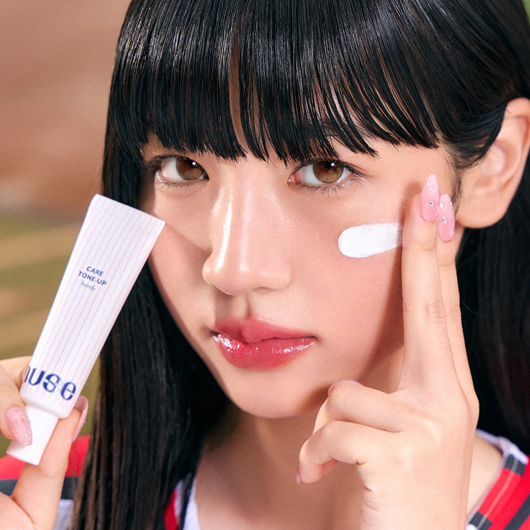 Woman applying NUSE X Landers Care Tone Up Handy cream for radiant skin