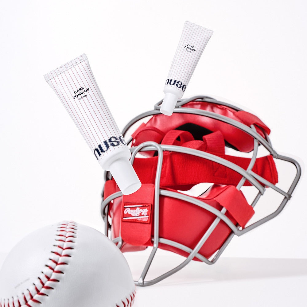 NUSE X Landers Care Tone Up Handy skincare products with sports gear, including a baseball and a catcher’s helmet, for dynamic appeal