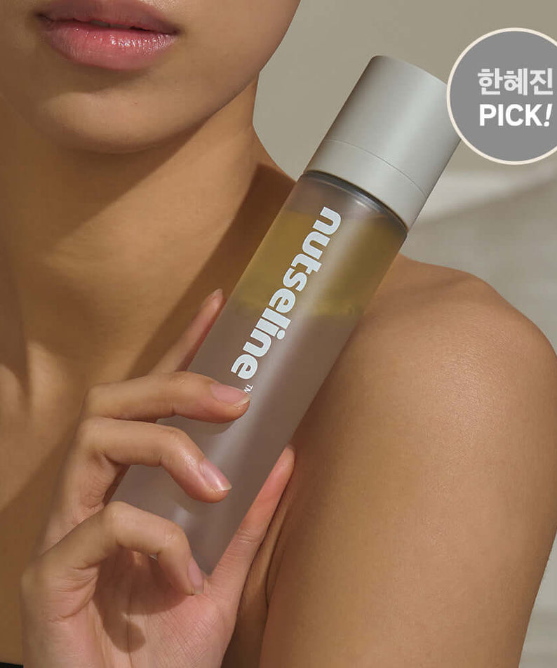 Woman holding NUTSELINE Aroma Nut Gray Body Mist 130ml bottle