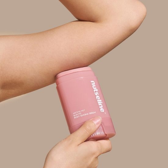 Person applying NUTSELINE Aroma Nut Slim Fit Body Guasha Serum 60ml on arm for smooth skin